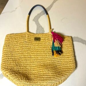 FEED woven tote with tassel.